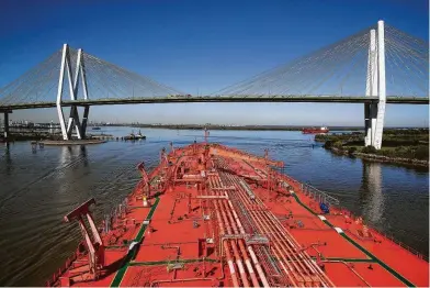  ?? Staff file photo ?? The Bergitta, a crude oil tanker, heads up the Houston Ship Channel in early November. Shippers of petroleum products are competing with large container ships for space in the busy waterway.