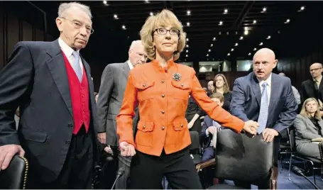  ?? J. SCOTT APPLEWHITE/THE ASSOCIATED PRESS ?? Former Arizona Rep. Gabrielle Giffords, who was seriously injured in the mass shooting that killed six people in Tucson two years ago, arrives at the Senate Judiciary Committee hearing on gun violence Wednesday.