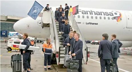  ?? — AP ?? Germany players at the Vnukovo internatio­nal airport outside Moscow on Tuesday.