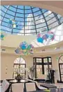  ?? ORLANDO SENTINEL ?? Argentine artist Tomas Saraceno’s “Cloud Cities — Nebulous Thresholds” hangs under the glass dome of the conservato­ry at the inn.
