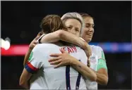  ?? AP PHOTO BY FRANCISCO SECO ?? United States’ Megan Rapinoe, center, celebrates with United States’ Tobin Heath after scoring her side’s second goal during the Women’s World Cup quarterfin­al soccer match between France and the United States at the Parc des Princes, in Paris, Friday, June 28.