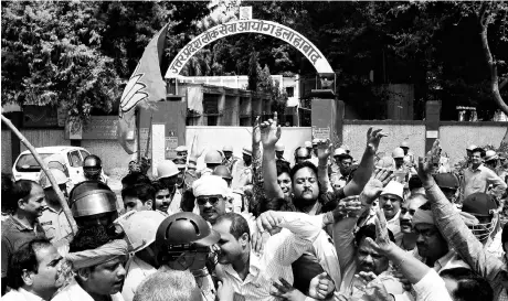  ??  ?? ( Above) A file photo of applicants protesting outside the state public service commission office in Allahabad after question papers were leaked just before the exam was to commence; (left) police lathicharg­e protesters to disperse them