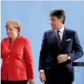  ?? AP ?? German Chancellor Angela Merkel, left, and the Prime Minister of Italy Giuseppe Conte, right, during talks in Berlin earlier this week.