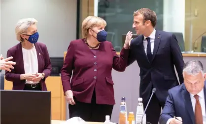  ?? Photograph: Thierry Monasse/Getty Images ?? Ursula von der Leyen looks on as Angela Merkel speaks to the French president, Emmanuel Macron, at an EU summit on Friday.