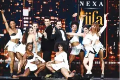  ??  ?? (Far right) Alia Bhatt performs during the IIFA Awards of the 18th Internatio­nal Indian Film Academy (IIFA) Festival at the MetLife Stadium in East Rutherford, New Jersey, on July 15. • (Above) Saif Ali Khan (right) and director/producer Karan Johar...