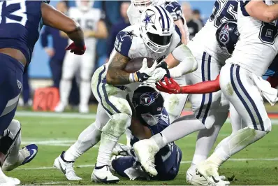  ?? (AP photo/Mark Zaleski) ?? Dallas Cowboys running back Ezekiel Elliott (21) runs into the end zone for a touchdown against the Tennessee Titans Dec. 29, 2022, during a football game in Nashville, Tenn.