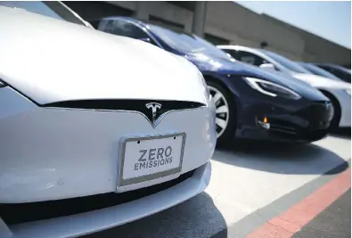  ?? JUSTIN SULLIVAN / GETTY IMAGES FILES ?? Tesla has been furiously cutting costs to avoid the need to raise capital this year but it will need to raise an estimated Us$10-billion by 2020 to fund its automaking operations, new products and expansion into China, observers say.