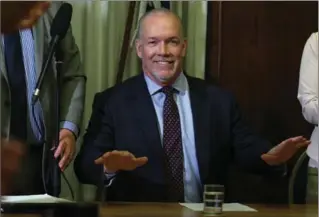  ?? CHAD HIPOLITO, THE CANADIAN PRESS ?? B.C. NDP Leader John Horgan delivers opening remarks to the New Democrat caucus before reviewing the agreement at the legislatur­e in Victoria, B.C., on Tuesday.