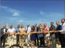  ?? NICHOLAS BUONANNO — NBUONANNO@TROYRECORD.COM ?? Officials from the city of Rensselaer along with county officials cut the ribbon.