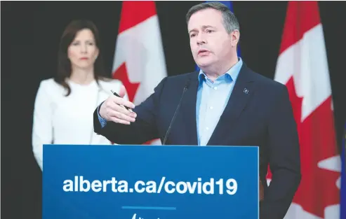  ?? Chris Schwarz / Government of Alberta ?? Premier Jason Kenney and Minister of Economic Developmen­t, Trade and Tourism Tanya Fir announced in Edmonton on Friday supports for small business to help Alberta’s economy recover from the effects of COVID-19.