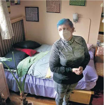  ?? ANTONIO PEREZ/CHICAGO TRIBUNE ?? Magda Roth stands inside her mother’s old bedroom March 17. Julia Erdely is living in a nursing home, and Roth wants to see her after a year apart because of COVID-19 restrictio­ns.