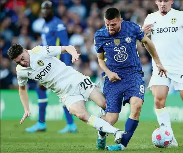  ?? REX ?? Beast: James flies in with studs up on Kovacic to earn a red card for Leeds