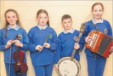  ?? (Photo: Sean Byrne) ?? 2nd in the Instrument­al Music section at the Waterford Scór na bPáistí county finals in Cappoquin Community Centre, were this group from Bothar na Naomh, Lismore.