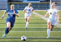  ?? JAMES C. SVEHLA/DAILY SOUTHTOWN ?? Sandburg’s Karli Ferguson drives the ball to the Plainfield East net as Delaney Shrupsha defends during a MOnday’s game in Orland Park.