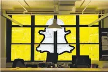 ??  ?? AN IMAGE of the Snapchat logo created with Post-it notes is seen in the windows of Havas Worldwide at 200 Hudson Street in lower Manhattan, New York, US, May 18, 2016, where advertisin­g agencies and other companies have started what is being called a...