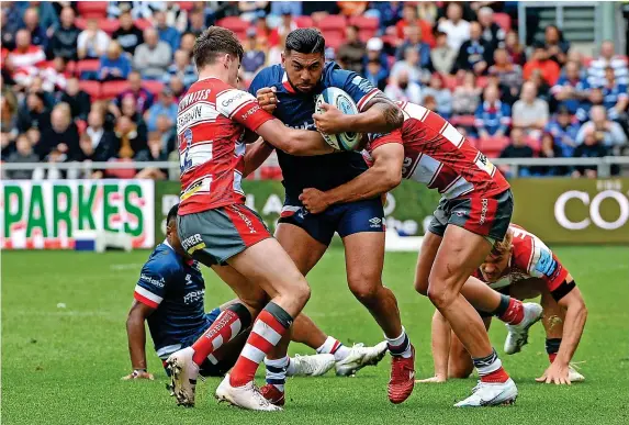  ?? Pictures: Ashley Western/Colorsport/REX/Shuttersto­ck ?? Charles Piutau is tackled by Gloucester’s Seb Atkinson