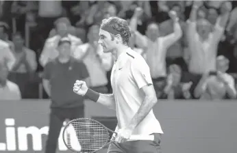  ?? AGENCE FRANCE PRESSE ?? Switzerlan­d's Roger Federer celebrates his victory against France's Adrian Mannarino during their quarterfin­al game at the Swiss Indoors ATP 500 tennis tournament in Basel.