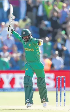  ?? Picture: Getty. ?? Mohammad Hafeez celebrates hitting the winning runs for Pakistan in their semifinal against England.