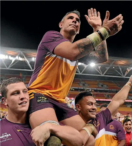  ??  ?? Corey Parker is chaired from the field after beating the Roosters.