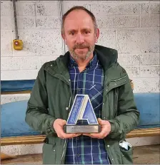  ??  ?? Brendan Glynn, coordinato­r of the North Cork Upholstery & Textile Design Classes, with their Aontas award.