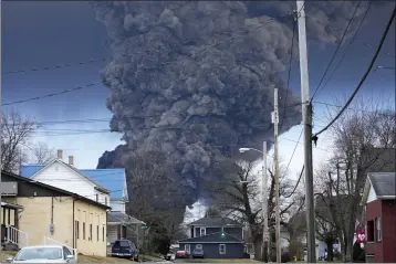  ?? GENE J. PUSKAR — THE ASSOCIATED PRESS FILE ?? A black plume rises over East Palestine, Ohio, as a result of a controlled detonation of a portion of the derailed Norfolk Southern trains on Feb. 6.