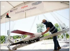  ?? (Novant Health via AP/Davis Turner) ?? In this undated image provided by Novant Health, a preflight check is done on drone before a delivery from Novant Health Logistics Center in Kannapolis, N.C., to Novant Health Medical Center in Huntersvil­le, N.C.