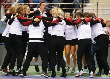  ?? Photo: AP ?? The Germany Fed Cup team celebrate their victory after the Fed Cup World Group first round match against Belarus in Minsk, Belarus.