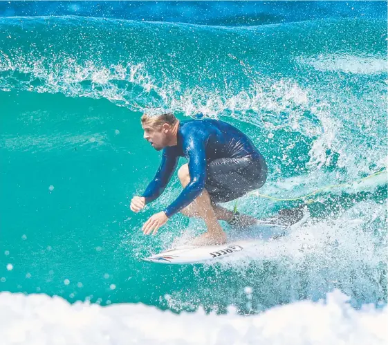  ?? Picture: NIGEL HALLETT ?? Mick Fanning enjoys a beautifull­y shaped Duranbah barfrel yesterday, a world away from a possible call to the Red Bull Cape Fear invitation­al.