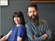  ?? HYOSUB SHIN / HSHIN@AJC.COM ?? Married artists Whitney and Micah Stansell at Drip Coffee Shop near a pedestrian bridge they will transform in downtown Hapeville.