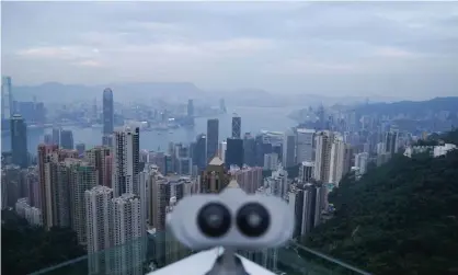  ?? Photograph: Lam Yik/Reuters ?? The view from The Peak district of Hong Kong where scammers preyed on a wealthy 90-year-old woman.