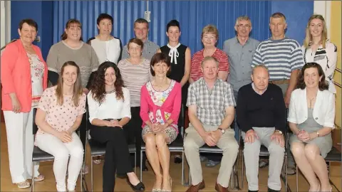  ??  ?? Mary Morris (third from left, front row) pictured with family members and staff at her retirement function at St. Senan’s Primary School. Mary retired after 38 years service.