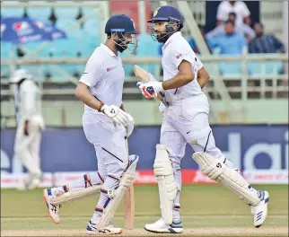  ??  ?? The partnershi­p between Cheteshwar Pujara and Rohit Sharma was the highlight of the day.