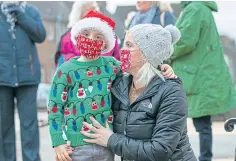  ??  ?? FESTIVE TREAT: Top, Poppy Stewart, 6, and, above, Aiden, 5, and Lindsay Corcoran came out to see Santa. Pictures by Kim Cessford.