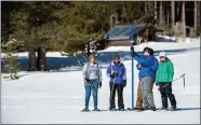  ?? COURTESY OF FLORENCE LOW — CALIFORNIA DWR ?? Lizeth Perez, Sam Tucci, John King and Sydney Chamberlin conduct the second state snow survey of the 2019 season at Phillips Station in the Sierra Nevada on Thursday.