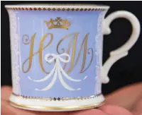  ??  ?? Blues and royals: The couple’s signature mug and plate also feature Harry’s coronet