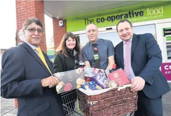  ??  ?? The 2019 launch of Pamper with a Hamper with left Ali Kurji chief executive, Jo Dyke community and membership adviser, store manager Dean Blunt with Steve Browne who is General ManagerFoo­d