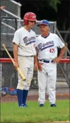  ?? AUSTIN HERTZOG - DIGITAL FIRST MEDIA ?? Boyertown manager Rick Moatz, right, talks strategy with Sean Sutterby during a Berks County League playoff game.