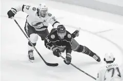  ?? [DAN HAMILTON/ USA TODAY SPORTS] ?? The Lightning’s Ryan Mcdonagh collides with the Blue Jackets’ Pierre-luc Dubois in the first period of Monday’s game.