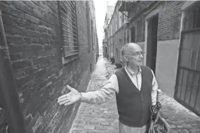  ??  ?? Memphis historian Jimmy Ogle stands in Jack Tucker alley as he talks about the city's downtown landscape.