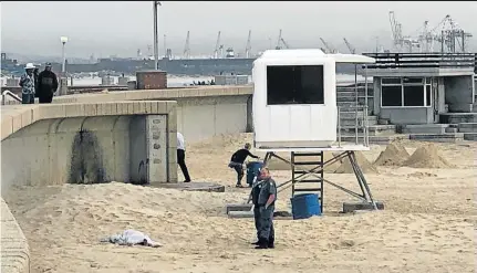  ??  ?? SAFETY FEARS: Police on the scene at Hobie Beach where a 34-year-old car guard was stabbed to death yesterday morning