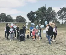  ??  ?? People gather to release balloons for Bradley in Shiney Row.