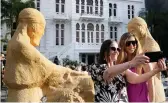  ?? AP ?? Guests take a selfie in the courtyard of the restored Sursock Museum during its opening in Beirut on Friday.