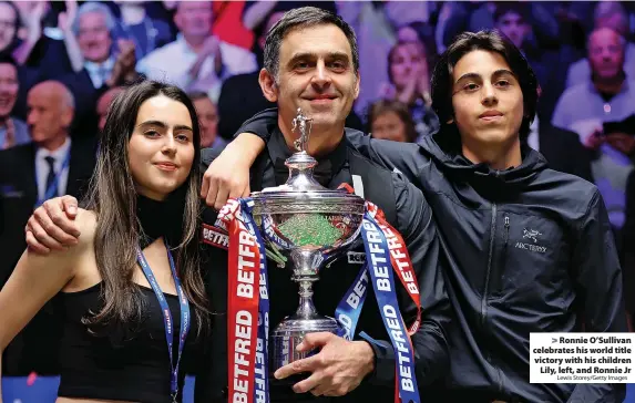  ?? Lewis Storey/Getty Images ?? Ronnie O’Sullivan celebrates his world title victory with his children Lily, left, and Ronnie Jr