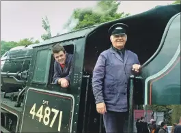  ?? Photograph: Iain Ferguson ?? Bobby, right, with fireman Lewis MacLean, aboard engine no. 44871, pulling the Jacobite steam service from Fort William to Mallaig; and right former collegues pay their respects.