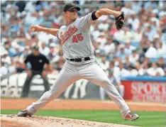  ?? FRANK FRANKLIN II/ASSOCIATED PRESS ?? Baltimore Orioles’ Dennis Sarfate delivers a pitch during the first inning of a baseball game against the New York Yankees on July 30, 2008, in New York.