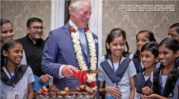 ?? Picture: PA ?? This cake’s lighter than heir...Charles chuckles as he cuts the birthday treat for schoolchil­dren in Mumbai while on an official visit to India