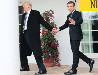  ?? PABLO MARTINEZ MONSIVAIS / THE ASSOCIATED PRESS ?? President Donald Trump and French President Emmanuel Macron walk to the Oval Office of the White House Tuesday, a meeting of the leaders that included an odd moment when Trump brushed dandruff off Macron’s jacket.