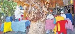  ??  ?? BMC health workers screen a resident of Mahim Police Colony on Tuesday.