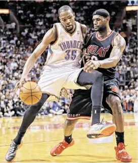  ?? Alan Diaz / Associated Press ?? Thunder forward Kevin Durant, left, wants people to recognize how he has improved his game; LeBron James will settle for merely being the best … ever.