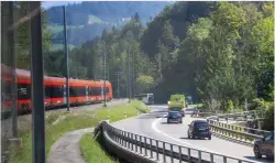  ?? ?? The Voralpen Express parallels a highway as it climbs from ArthGoldau toward Rothernthu­rm on its way to St. Gallen.